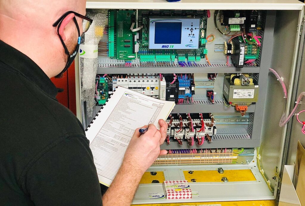 Photo of DAC Engineer completing QC checks